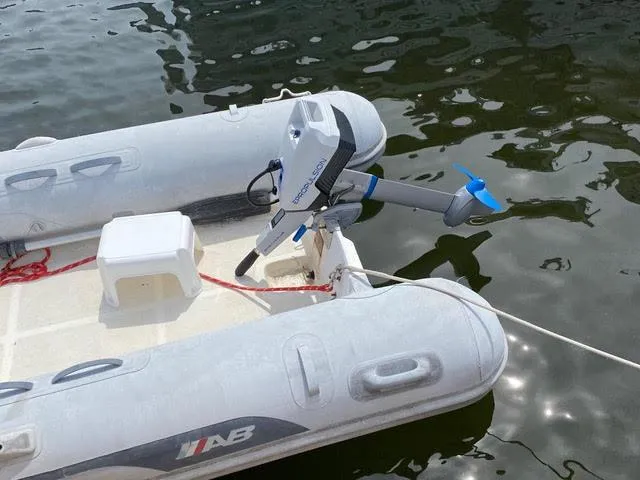 Slide: The Image of Inflatable boat with outboard motor on water, Grand Banks 36 Classic 1989. - 23