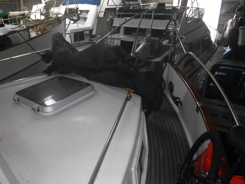 Slide: The Image of 1989 Grand Banks 36 Classic yacht in harbor, front deck view. - 38