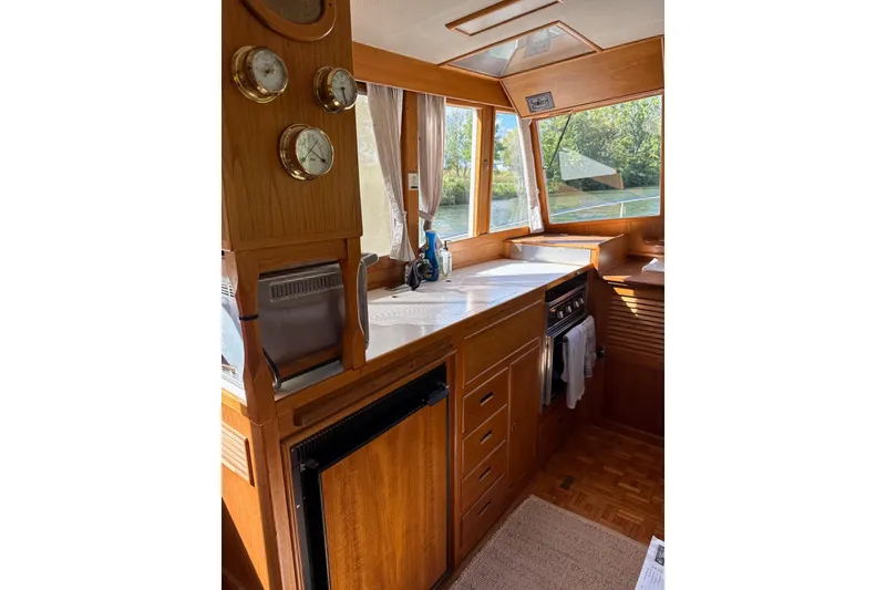 Slide: The Image of Interior of 1989 Grand Banks 36 Classic yacht with wooden cabinetry and nautical instruments. - 5