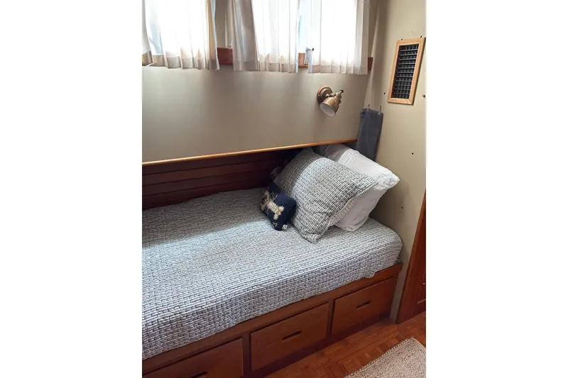 Slide: The Image of Cozy cabin bed in 1989 Grand Banks 36 Classic yacht with nautical decor. - 57