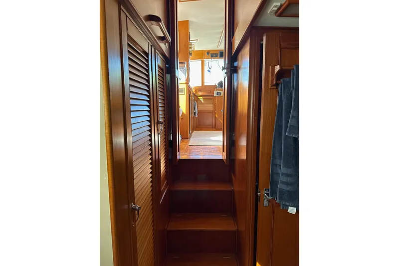 Slide: The Image of Interior view of 1989 Grand Banks 36 Classic yacht with wooden stairs and cabinetry. - 60