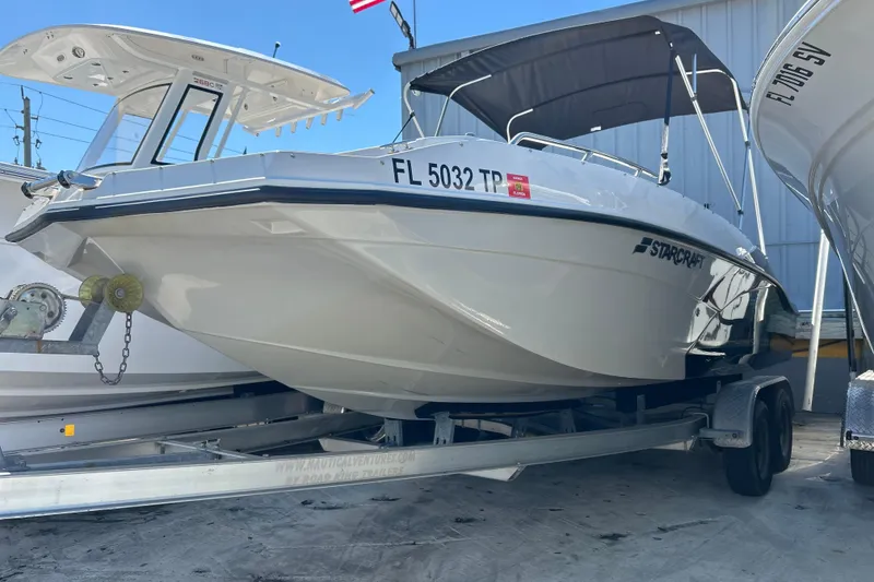 The Image of 2023 Starcraft SVX 211 IO boat on trailer, displayed outdoors. - 0