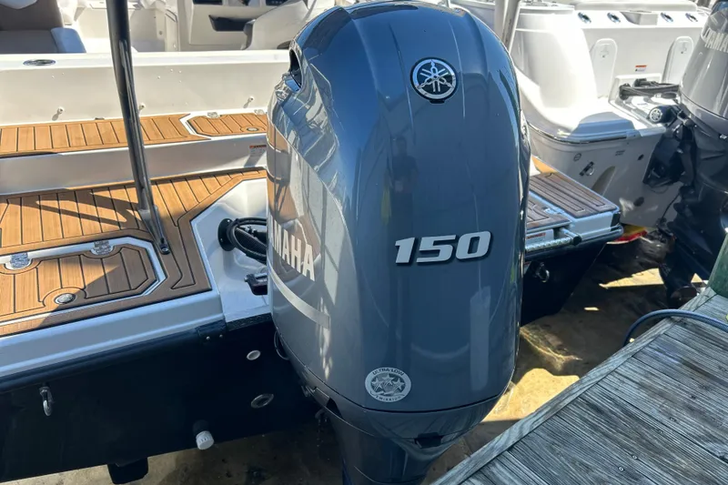 Slide: The Image of 2023 Starcraft SVX 211 IO boat with Yamaha 150 outboard motor. - 12