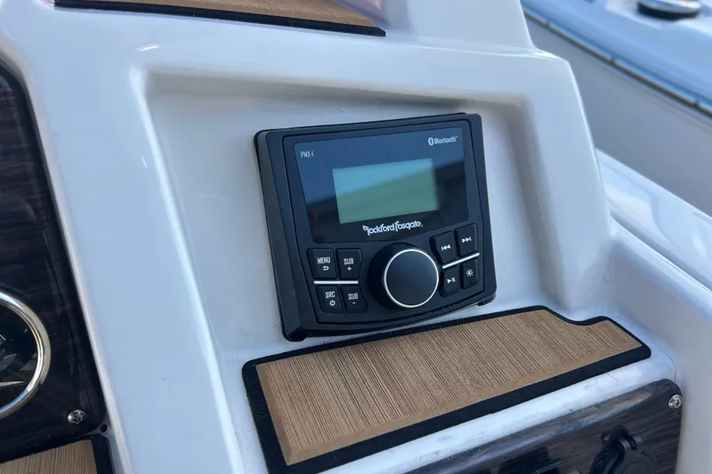 Slide: The Image of 2023 Starcraft SVX 211 IO boat dashboard with Rockford Fosgate Bluetooth stereo system. - 2