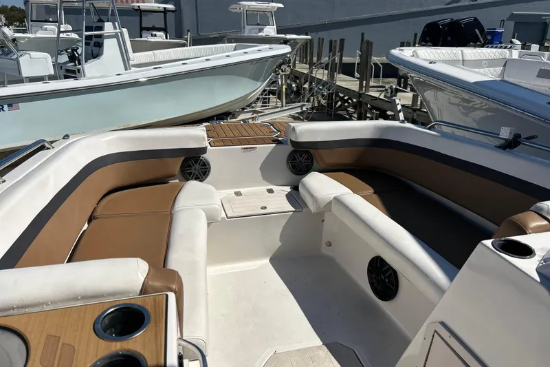 Slide: The Image of 2023 Starcraft SVX 211 IO boat interior with spacious seating and cup holders. - 4