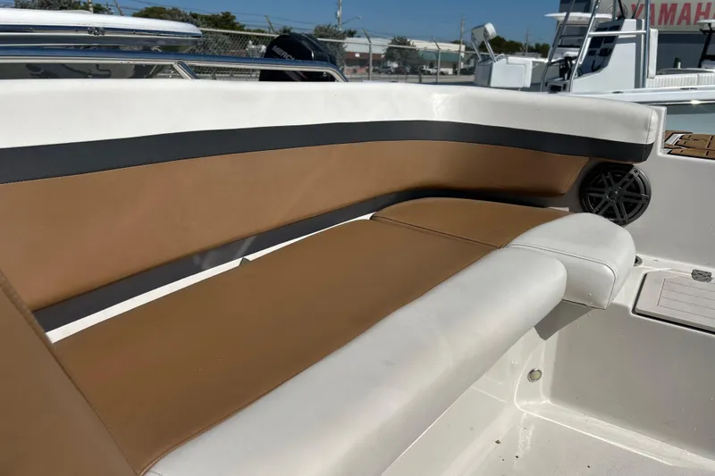 Slide: The Image of 2023 Starcraft SVX 211 IO boat interior with tan and white seating. - 5