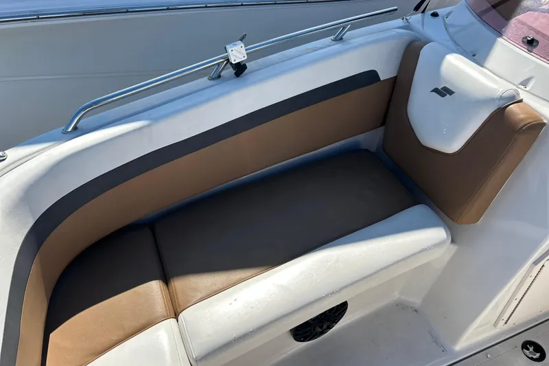 Slide: The Image of 2023 Starcraft SVX 211 IO boat interior with brown and white seating. - 7