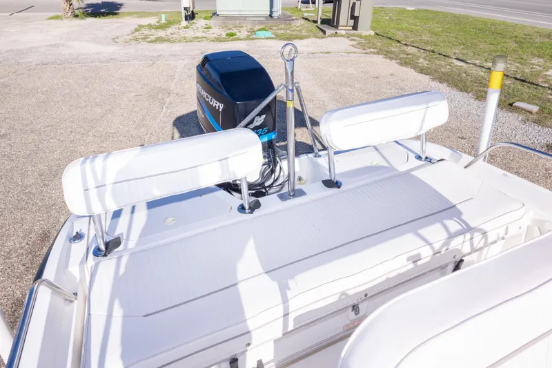 Slide: The Image of 2001 Boston Whaler 18 Dauntless boat with Mercury outboard motor, rear seating view. - 15