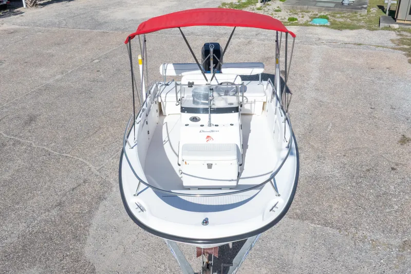 Slide: The Image of 2001 Boston Whaler 18 Dauntless boat with red canopy, viewed from above. - 33