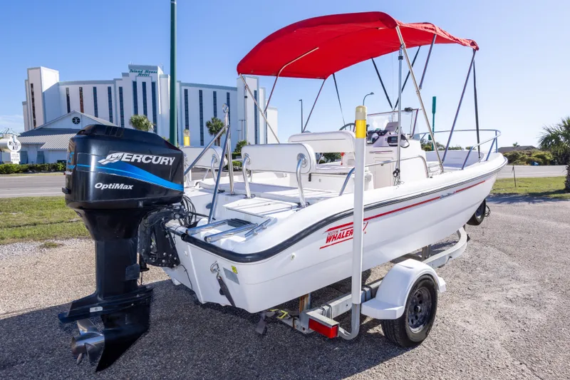 Slide: The Image of 2001 Boston Whaler 18 Dauntless boat with Mercury OptiMax engine and red canopy. - 4