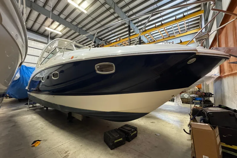 The Image of 2015 Chaparral 330 Signature boat in indoor storage facility. - 0