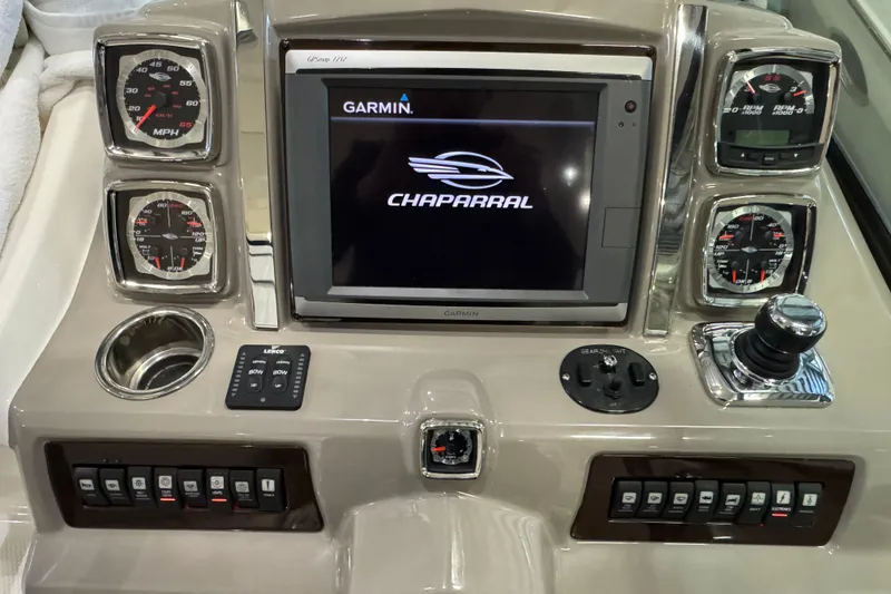Slide: The Image of Dashboard of 2015 Chaparral 330 Signature boat with Garmin display and gauges. - 16