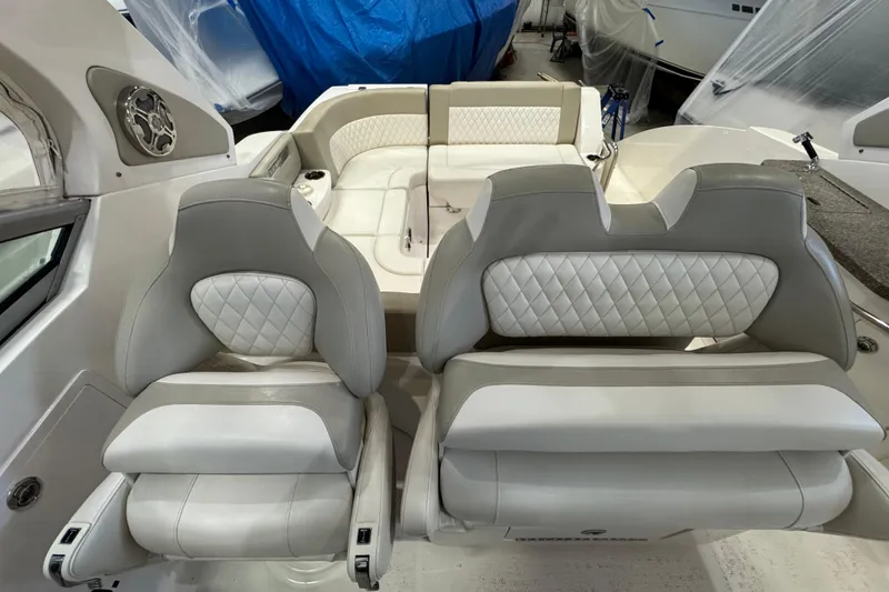 Slide: The Image of 2015 Chaparral 330 Signature boat interior with luxurious seating and elegant design. - 21