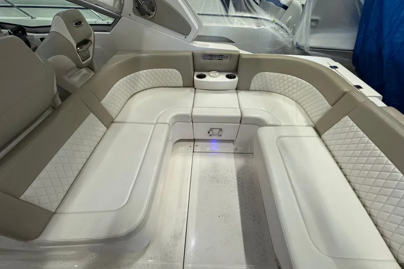Slide: The Image of Luxurious seating area on a 2015 Chaparral 330 Signature boat with quilted upholstery. - 9