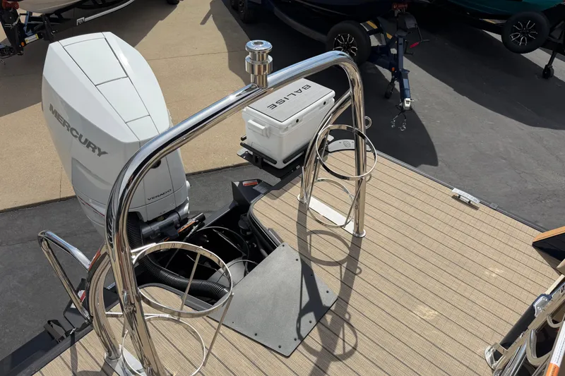 Slide: The Image of Balise HORIZON26C boat deck with Mercury engine, 2025 model, featuring stainless steel railings. - 16