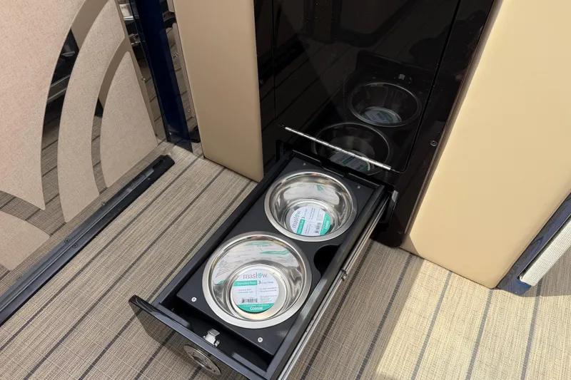 Slide: The Image of Pull-out pet feeding station in Balise HORIZON26C 2025 model, featuring stainless steel bowls. - 23