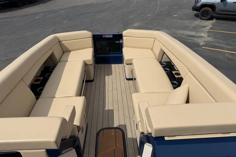 Slide: The Image of Luxurious seating on 2025 Balise HORIZON26C boat, featuring beige upholstery and cup holders. - 24