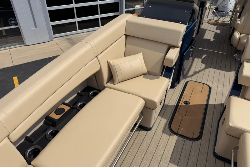 Slide: The Image of Luxurious seating on 2025 Balise HORIZON26C boat with beige upholstery and wood flooring. - 25