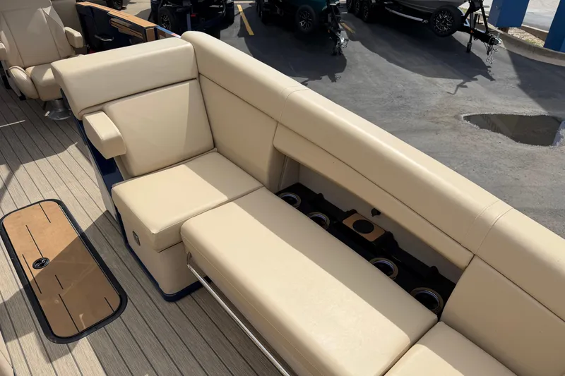 Slide: The Image of Luxurious seating on 2025 Balise HORIZON26C boat with beige upholstery and cup holders. - 26