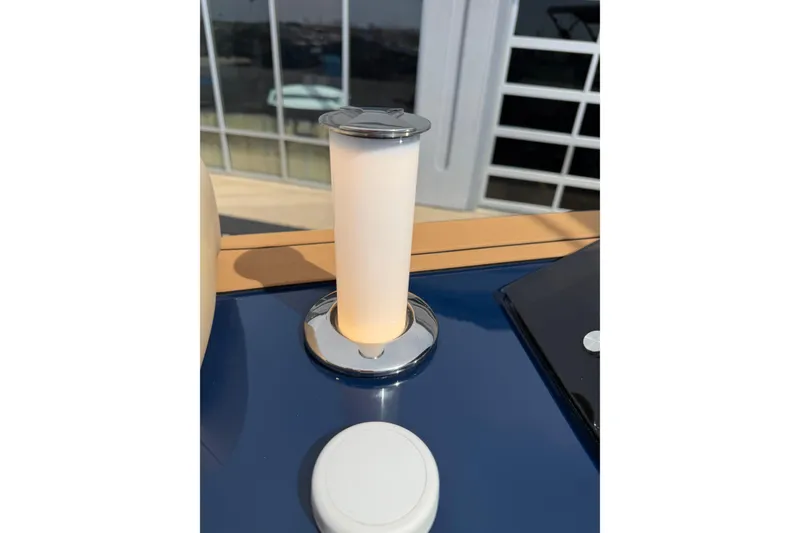 Slide: The Image of Modern Balise HORIZON26C 2025 yacht interior with sleek lighting fixture and reflective surfaces. - 27