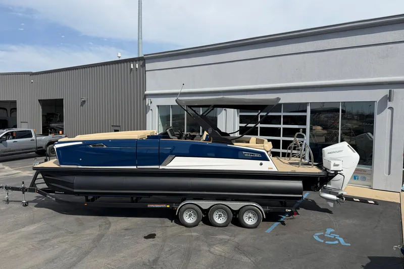 Slide: The Image of 2025 Balise HORIZON26C boat on trailer outside a modern building. - 3