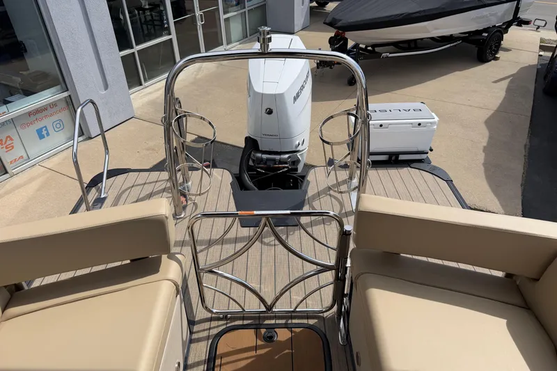 Slide: The Image of 2025 Balise HORIZON26C boat with Mercury engine, beige seating, and stainless steel railings. - 31
