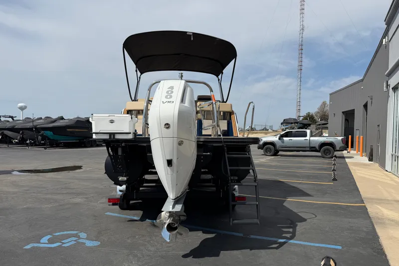 Slide: The Image of 2025 Balise HORIZON26C boat with powerful outboard motor in a parking lot. - 6