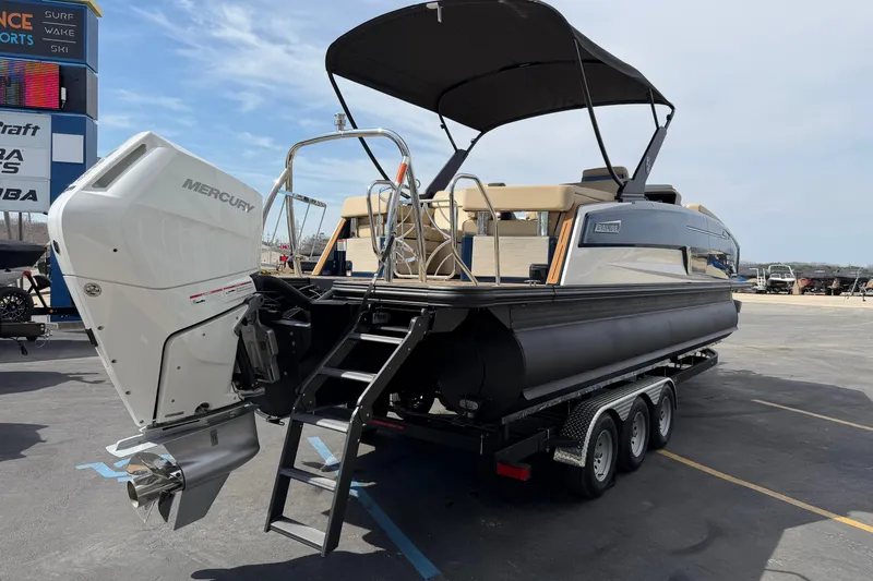 Slide: The Image of 2025 Balise HORIZON26C boat with Mercury engine on trailer, outdoor display. - 8