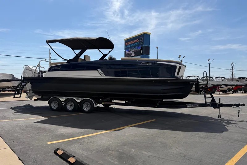 Slide: The Image of 2025 Balise HORIZON26C boat on trailer in parking lot under clear sky. - 9