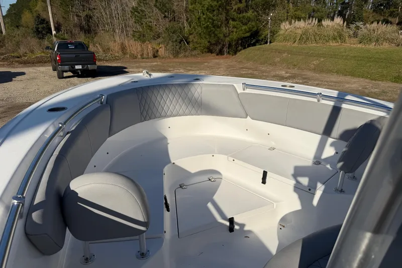 Slide: The Image of 2019 Sportsman Heritage 231 Center Console boat interior with seating and storage. - 12