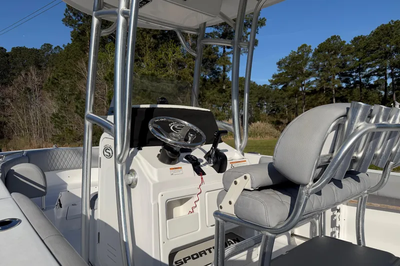 Slide: The Image of 2019 Sportsman Heritage 231 Center Console boat interior with steering wheel and seating. - 5