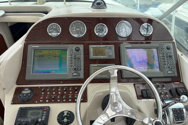 Slide: The Image of Dashboard of 2008 Searay 290 AMBERJACK with navigation and control instruments. - 11