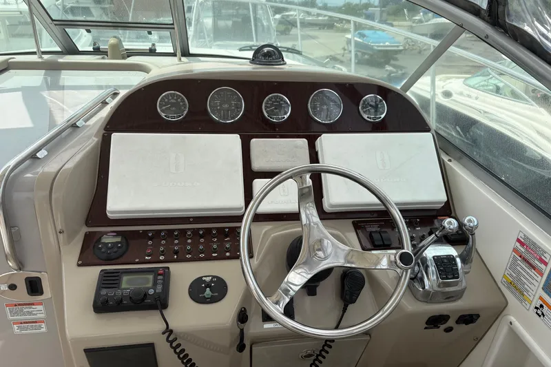 Slide: The Image of 2008 Searay 290 AMBERJACK boat dashboard with steering wheel and control panel. - 14