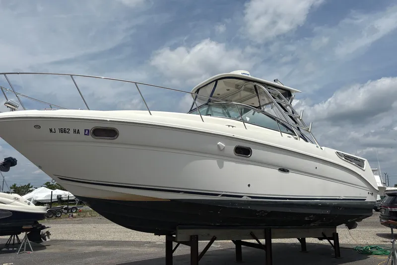 Slide: The Image of 2008 Searay 290 AMBERJACK boat on dry dock under cloudy sky. - 4