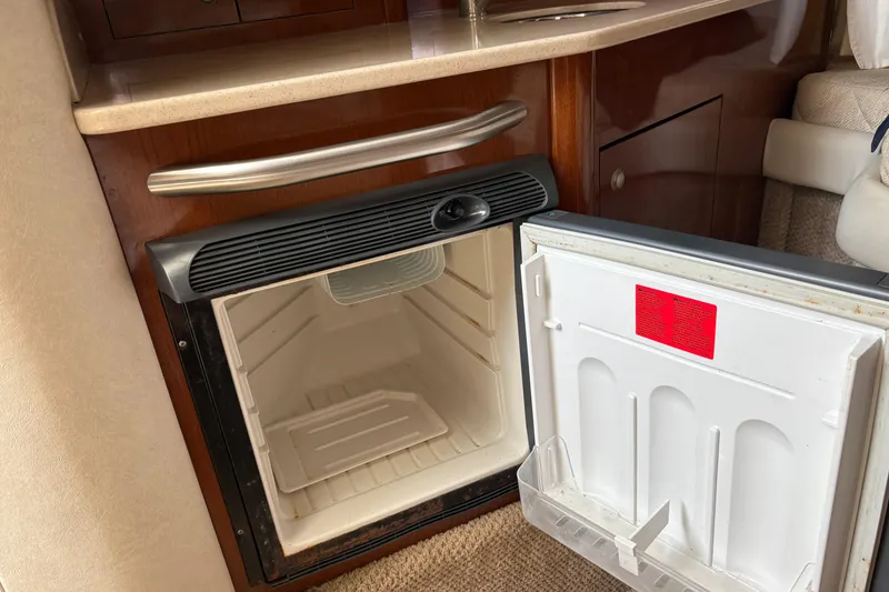 Slide: The Image of Open mini fridge inside 2008 Searay 290 AMBERJACK boat cabin. - 9
