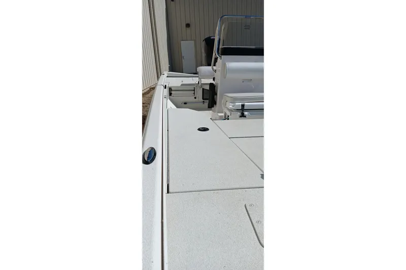 Slide: The Image of 2024 Ranger RB200 boat deck with seating and storage compartments. - 16