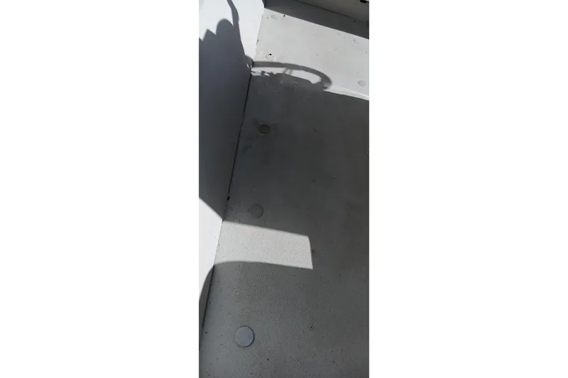 Slide: The Image of 2024 Ranger RB200 boat interior with shadowed deck area. - 17