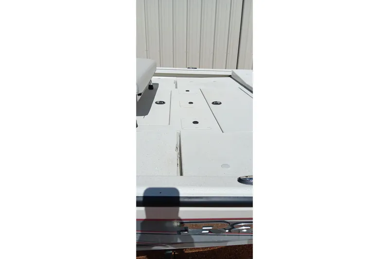 Slide: The Image of 2024 Ranger RB200 boat deck with storage compartments, shown in a bright outdoor setting. - 21