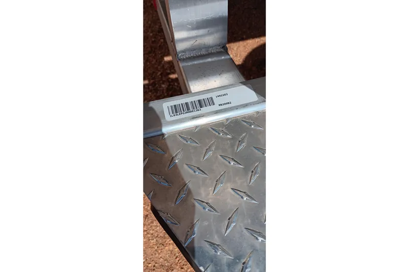 Slide: The Image of Barcode on 2024 Ranger RB200 metal surface with diamond plate pattern. - 24