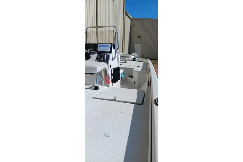 Slide: The Image of 2024 Ranger RB200 boat with Lowrance equipment, docked near a beige building. - 6