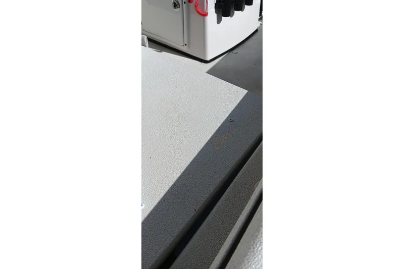 Slide: The Image of 2024 Ranger RB200 boat interior with textured flooring and storage compartment. - 7