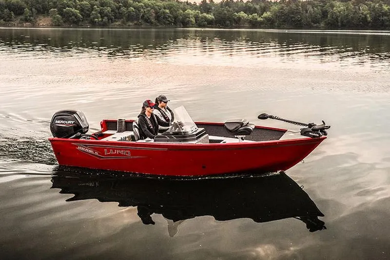 Slide: The Image of Manufacturer Provided Image: 2025 Lund 1650 Rebel XL SS boat cruising on a calm lake. - 4