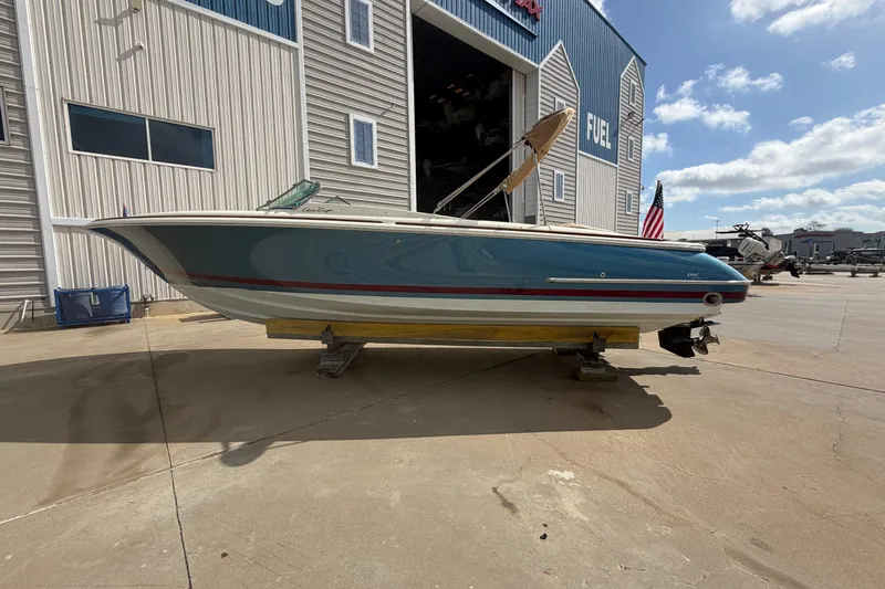 The Image of 2001 Chris-Craft Launch 28 boat outside warehouse. - 0