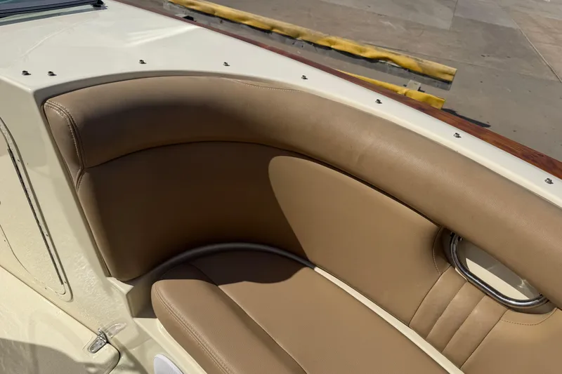Slide: The Image of Luxurious tan leather seating on a 2001 Chris-Craft Launch 28 boat. - 20