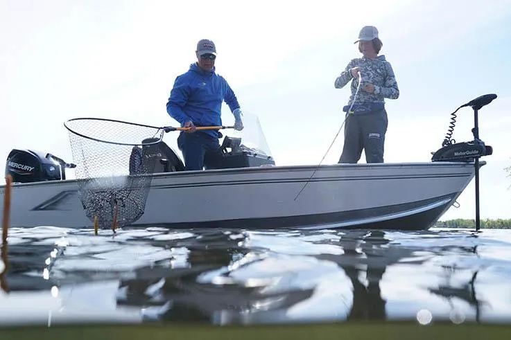 Slide: The Image of Manufacturer Provided Image: Two people fishing on a 2025 Lund 1600 Fury SS boat. - 3