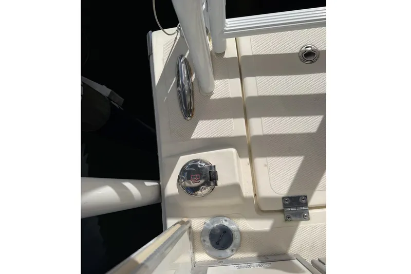 Slide: The Image of Deck view of a 2017 Beachcat 230 boat, featuring cleats and fittings. - 22