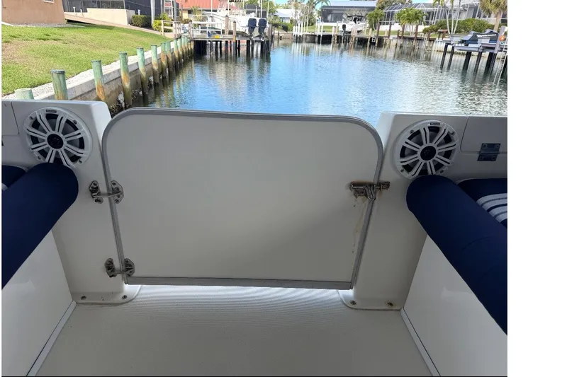 Slide: The Image of Rear view of a 2017 Beachcat 230 boat with open gate and waterway. - 6