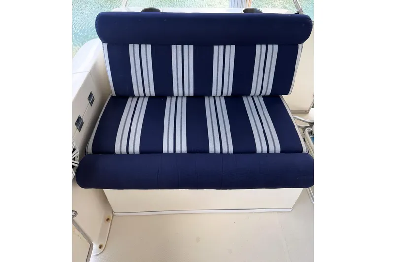 Slide: The Image of Blue and white striped seat on 2017 Beachcat 230 boat. - 8