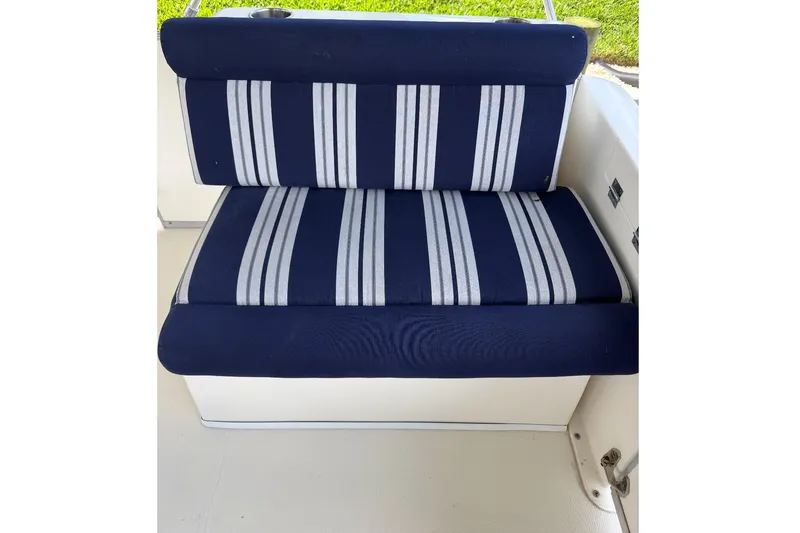 Slide: The Image of Blue and white striped seat on 2017 Beachcat 230 boat. - 9