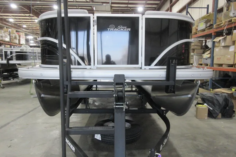 Slide: The Image of 2026 Sun Tracker Party Barge 22 DLX pontoon boat in warehouse setting. - 10